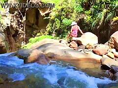 Lilyan moans while masturbating by the river