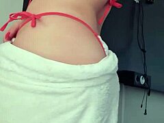 Latina woman displays natural features by the window