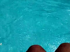 feet splashing playfully in pool with lots of water