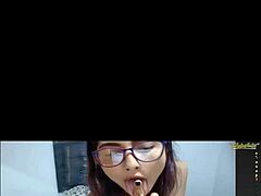 The 25-year-old latina webcam girl chats with viewers in her room.