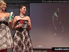 Strippers Tease Audience With Dancing