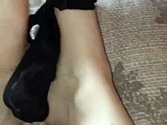 Alternative Ebony Beauty Rubs Thong on Bare Feet Sensually