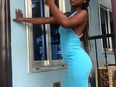 A crazy girl twerks wildly on the outdoor balcony