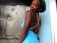 A crazy girl twerks wildly on the outdoor balcony