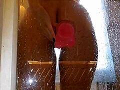 is that girl playing with her pink toy in the shower?