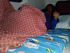 Hey, sharing a bed with my horny stepmom led to an unexpected creampie under the sheets!