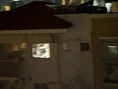 asian slut deepthroats on building rooftop.