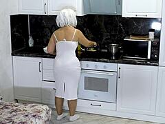 Stepson surprises mature stepmom with anal sex in the kitchen, making her forget about preparing breakfast.