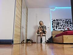 The blonde model showcases high heels in the glamorous fashion show, highlighting her short hair and feet with socks.