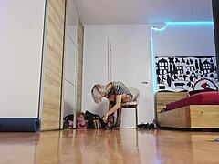 The blonde model showcases high heels in the glamorous fashion show, highlighting her short hair and feet with socks.