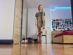 The blonde model showcases high heels in the glamorous fashion show, highlighting her short hair and feet with socks.