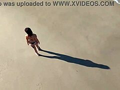 Redhead Latina Walks On Beach Publicly