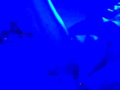 under the blacklight, this chick with black feet gives an intense footjob, sucking on toes and all that fetish stuff