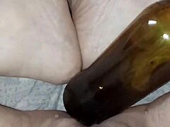 gretala, being pregnant and excited, rubs the bottle on her juicy pussy lips