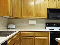 Naked Woman Cooking In The Kitchen