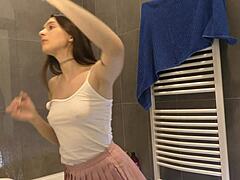 braless hot brunette skinny and horny babe in a pink mini skirt to show her beautiful ass and legs in the bathroom
