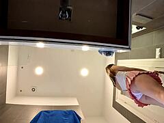 braless hot brunette skinny and horny babe in a pink mini skirt to show her beautiful ass and legs in the bathroom