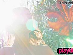 petite woman undresses outdoors